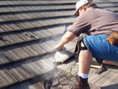Jack is removing some old tiles from the roof